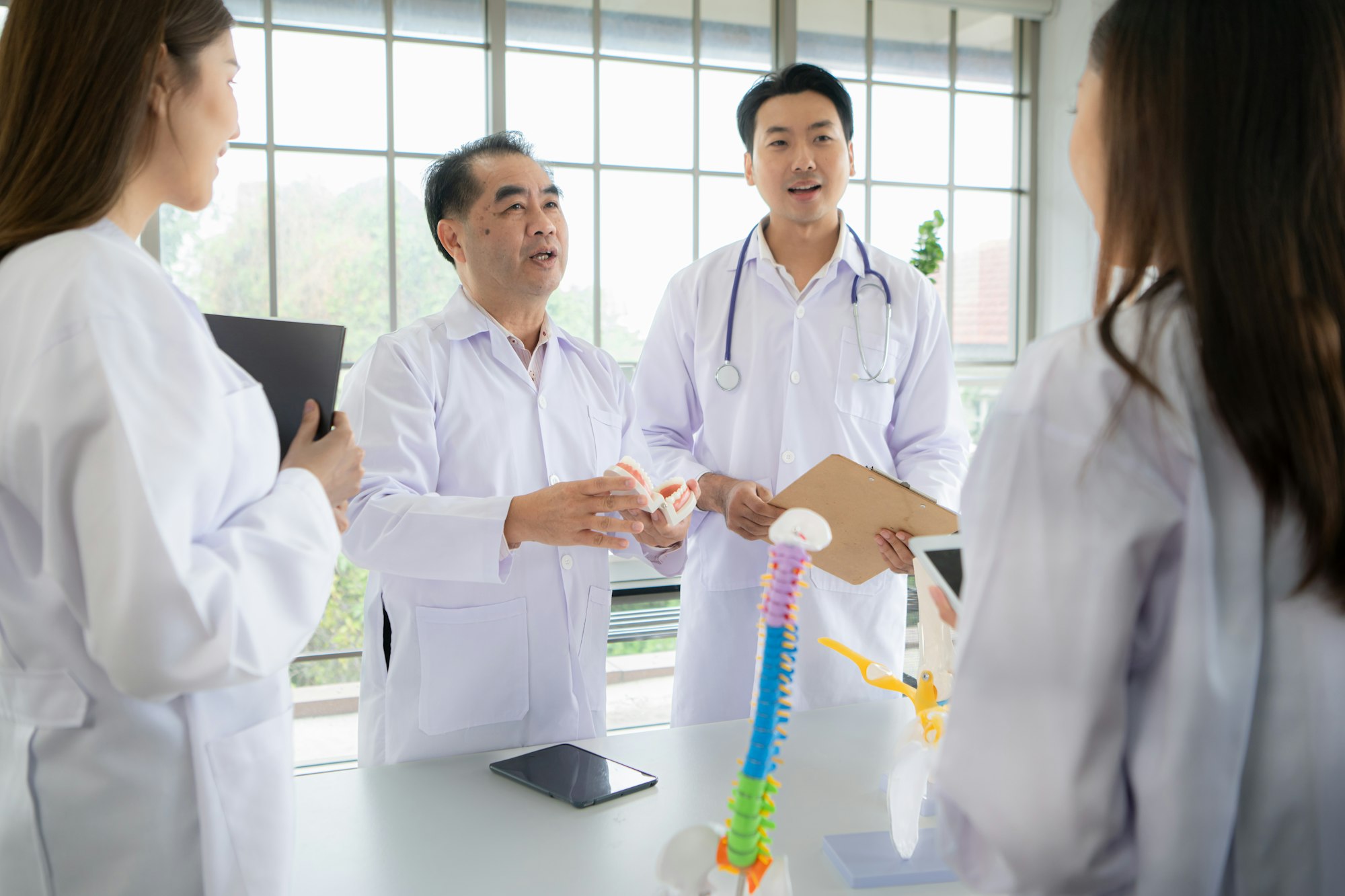 A medical professor is lecturing on a case study related to oral and dental treatment